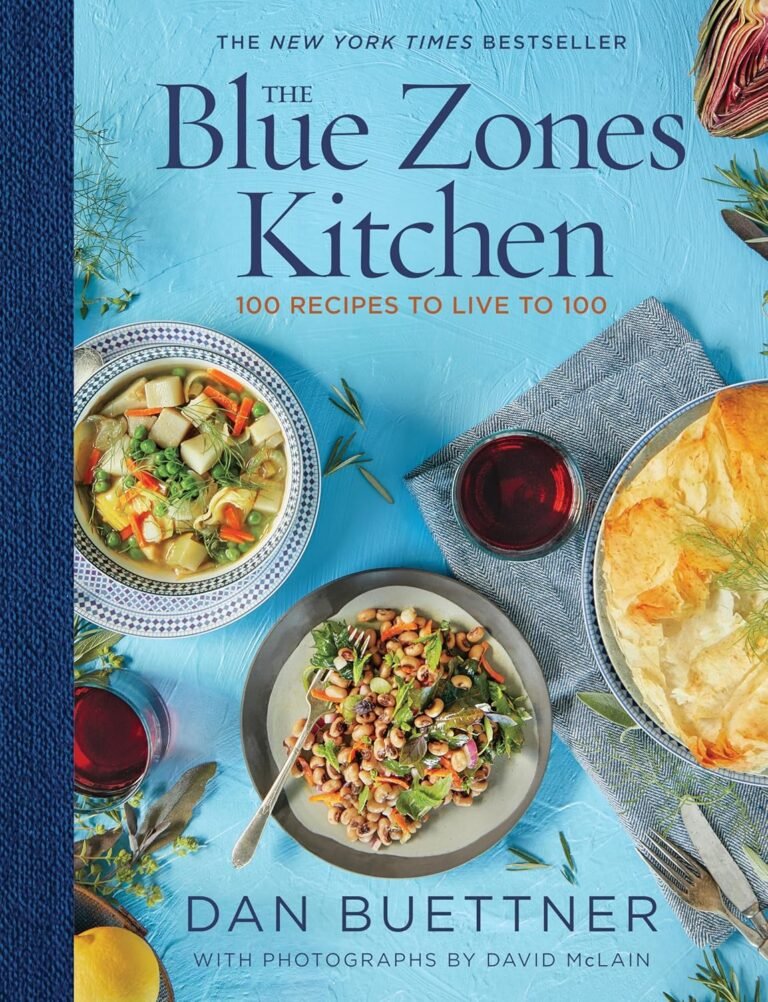 Cover of "The Blue Zones Kitchen" by Dan Buettner, featuring vibrant dishes from one of the top healthy cook books promoting longevity.