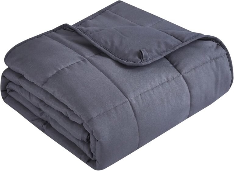 Folded gray weighted blanket highlighting the pros and cons of weighted blankets for better sleep and anxiety relief.